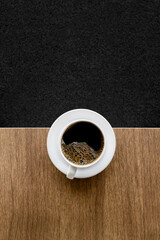Minimalist White Coffee Cup on Wooden Table. top view