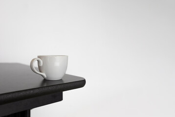 Minimalist White Coffee Cup on Wooden Table