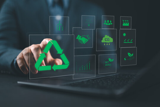 Sustainable development planning concept. Man using a laptop with virtual icons related to recycling, ESG business sustainability investment strategy renewable energy and environmental protection.