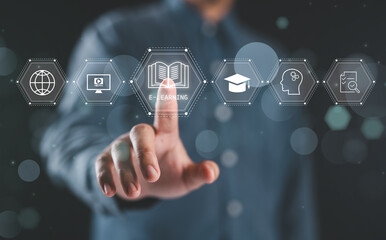 Online education concepts. A man interacts with e-learning icons virtually, signifying modern online education methods. Learning online webinar, video tutorials, training study course.