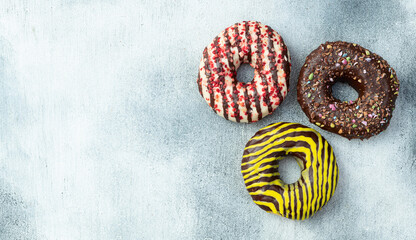 Sweet glazed colorful donuts . Top view