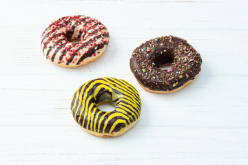 Sweet glazed colorful donuts . Top view