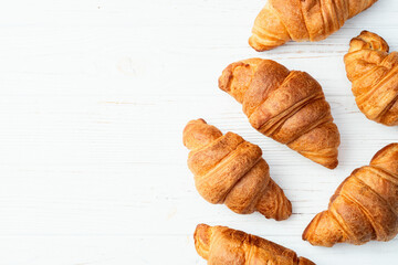 Group of sweet croissant . French morning breakfast . Top view