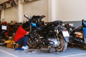 Professional Mechanic Working on a Bike in Repair Shop