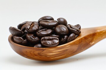 Obraz premium Roasted Coffee Beans Sit in Wooden Spoon on White Background Close Up