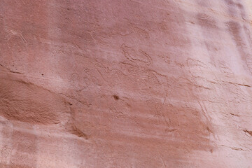 Detail of indigenous culture Petroglyphs etch in the walls along Potash Road in Moab Utah