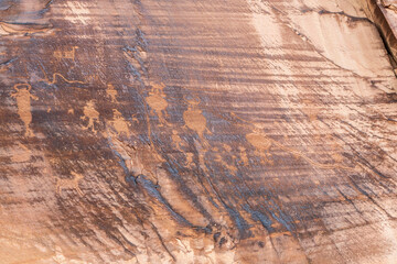 Detail of indigenous culture Petroglyphs etch in the walls along Potash Road in Moab Utah