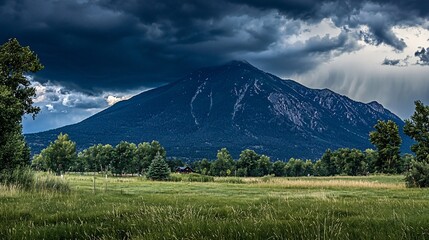 Fototapeta premium Dramatic Mountain Landscape Under Dark Clouds
