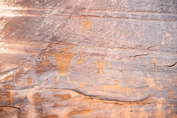Detail of indigenous culture Petroglyphs etch in the walls along Potash Road in Moab Utah