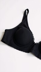 A black bra is presented against a pristine white background isolated