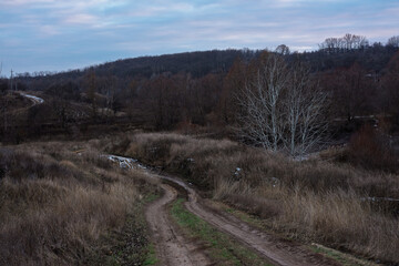 Winding dirt road through rural landscape