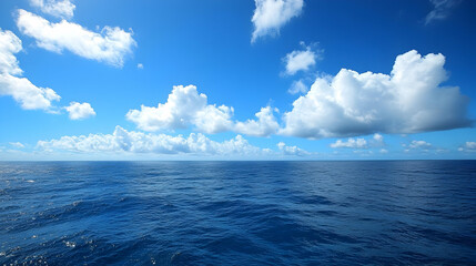 Obraz premium Blue Ocean Background with White Clouds