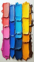 A vibrant palette of paint colors arranged in vertical stripes.