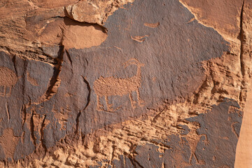 Detail of indigenous culture Petroglyphs etch in the walls along Potash Road in Moab Utah