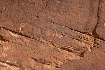 Detail of indigenous culture Petroglyphs etch in the walls along Potash Road in Moab Utah