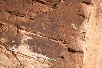 Detail of indigenous culture Petroglyphs etch in the walls along Potash Road in Moab Utah