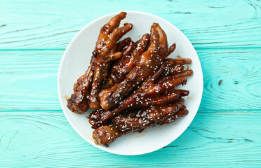 Caramelized korean or Chinese chicken foots ( paws ) with sesame . Top view