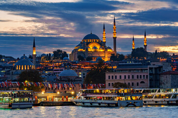 view from a pleasure boat on the Bosphorus and the cityscape of Istanbul, Turkey, the architecture of the city at sunset, a popular tourist destination.