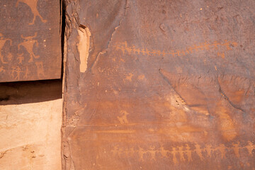 Detail of indigenous culture Petroglyphs etch in the walls along Potash Road in Moab Utah