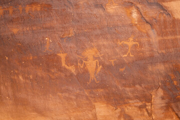 Detail of indigenous culture Petroglyphs etch in the walls along Potash Road in Moab Utah