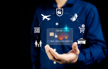 Credit Card.Businessman presents smart card for everyday spending for family. Online shopping, cash withdrawal, travel. Concept for borderless business. Dark tone photo.