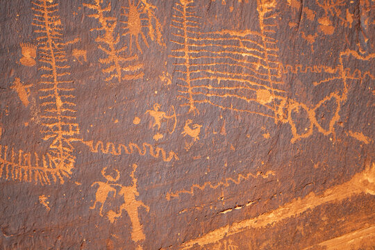 Detail of indigenous culture Petroglyphs etch in the walls along Potash Road in Moab Utah