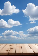 An empty wooden tabletop with blue skies and clouds is ideal for displaying merchandise