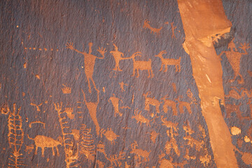 Detail of indigenous culture Petroglyphs etch in the walls along Potash Road in Moab Utah