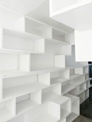 Minimalist White Shelving Design: A modern, geometric storage solution perfect for home decor and organization.