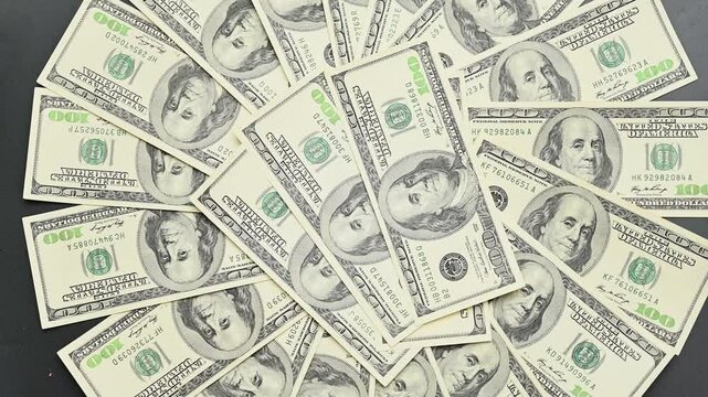 background of 100 dollars spinning