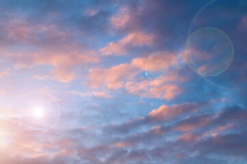 Lovely sunset sky landscape with dramatic clouds high in the sunset sky