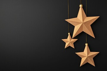 Fototapeta premium christmas pattern and minimalist stars, Three hanging golden stars in various sizes against a textured black background create a festive, elegant atmosphere.