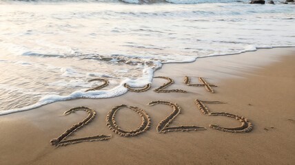 2024 to 2025 written text on beach sand & sea wave background. coming happy new year celebration concept.