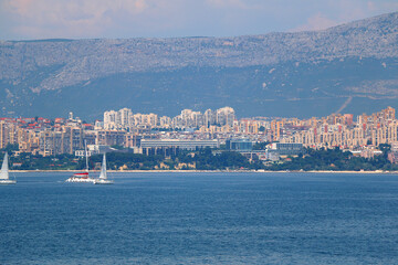 Contemporary buildings, gardens and beaches at the waterfront in Split, Croatia. View of Split from the boat.