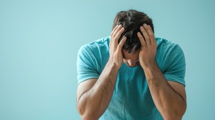 Man in Despair Holding His Head in His Hands