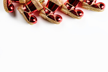 Christmas background with red Santa Claus felt boots on white background