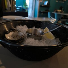 Oyster with sauce on ice