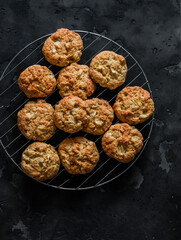Soft apple cookies on a dark background, top view