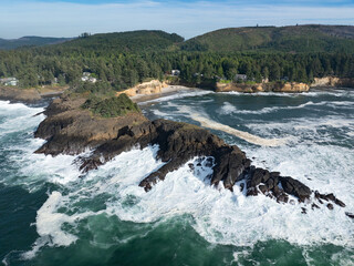 Pacific Ocean waves crash against the rugged coastline of Oregon, not far south of Lincoln City. This part of the Pacific Northwest coast is incredibly scenic and accessed from highway 101.