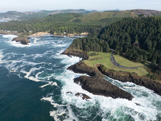 Pacific Ocean waves crash against the rugged coastline of Oregon, not far south of Lincoln City....