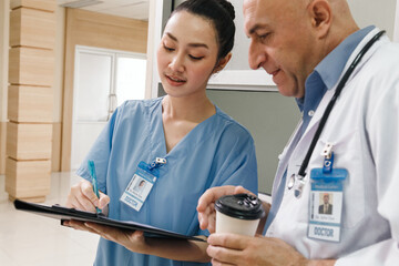 professor doctor give advice and discuss with intern student for surgery planning and patient treatment in the hospital medical school. healthcare and medical education concept.