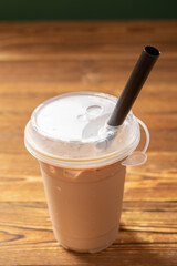 cup of milktea with tapiocas at vertical composition