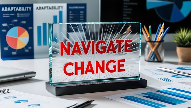 Glass block with "Navigate Change" text on office desk with charts and stationery.