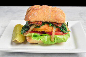 chicken   sandwich  top with onions, mushrooms and spinach