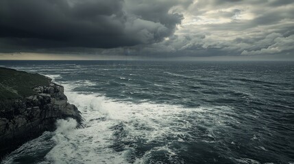 Dramatic coastal scene with dark clouds, rough sea, and rocky cliff.