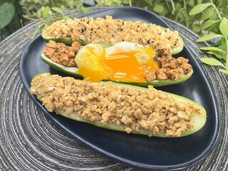 Grilled sesame mixed soy tempeh salad with soft boiled egg and cucumber