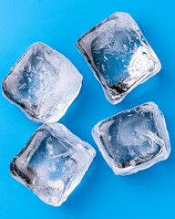 Obraz premium Four Clear Ice Cubes on Blue Background Refreshing Cool Frozen Water Drink