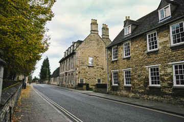 Beautiful English Street in Stamford with Lincolnshire Limestone Houses and Buildings in the Autumn, quintessential town and city in England © Liam