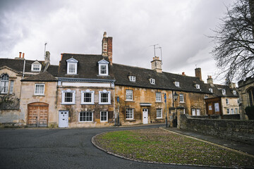 Beautiful English Street in Stamford with Lincolnshire Limestone Houses and Buildings in the Autumn, quintessential town and city in England © Liam