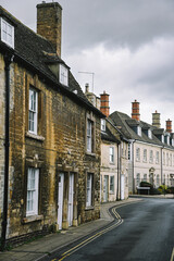 Beautiful English Street in Stamford with Lincolnshire Limestone Houses and Buildings in the Autumn, quintessential town and city in England © Liam